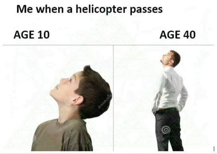 Young boy and middle-aged man looking up at a passing helicopter, illustrating meme humor for entertaining memes.