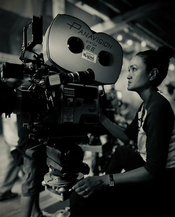 Woman operating a Panavision film camera, showcasing ladies who chose power tools and lab coats over manicures.