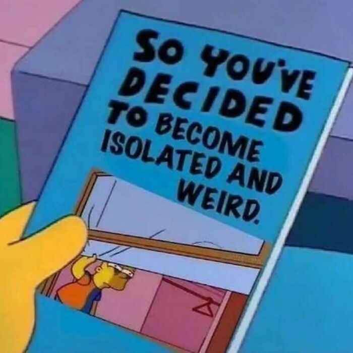 Close-up of a cartoon hand holding a blue book with bold text about becoming isolated and weird, relating to existential crisis memes.