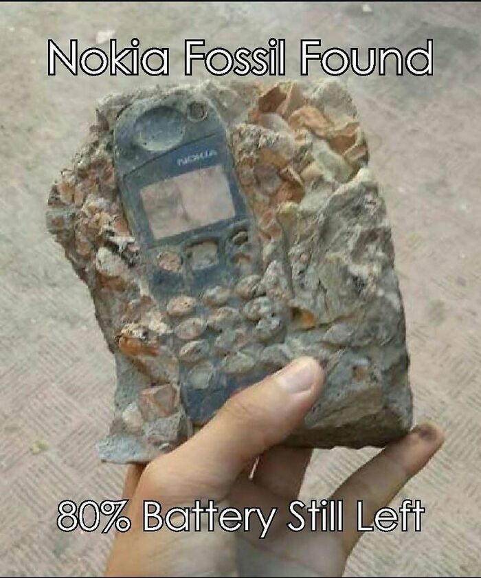 Stone fossil of an old Nokia phone, representing '90s technology and parts of our lives that don’t exist anymore.