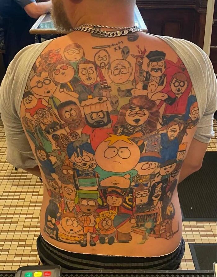 Full back tattoo featuring multiple colorful characters from South Park, creating a bizarre and cursed photo effect.