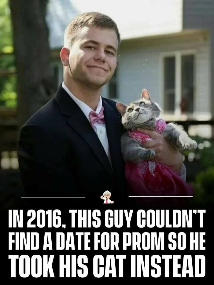 Young man in a suit holding his cat at prom, a wholesome moment featured in interesting facts from all over the world.