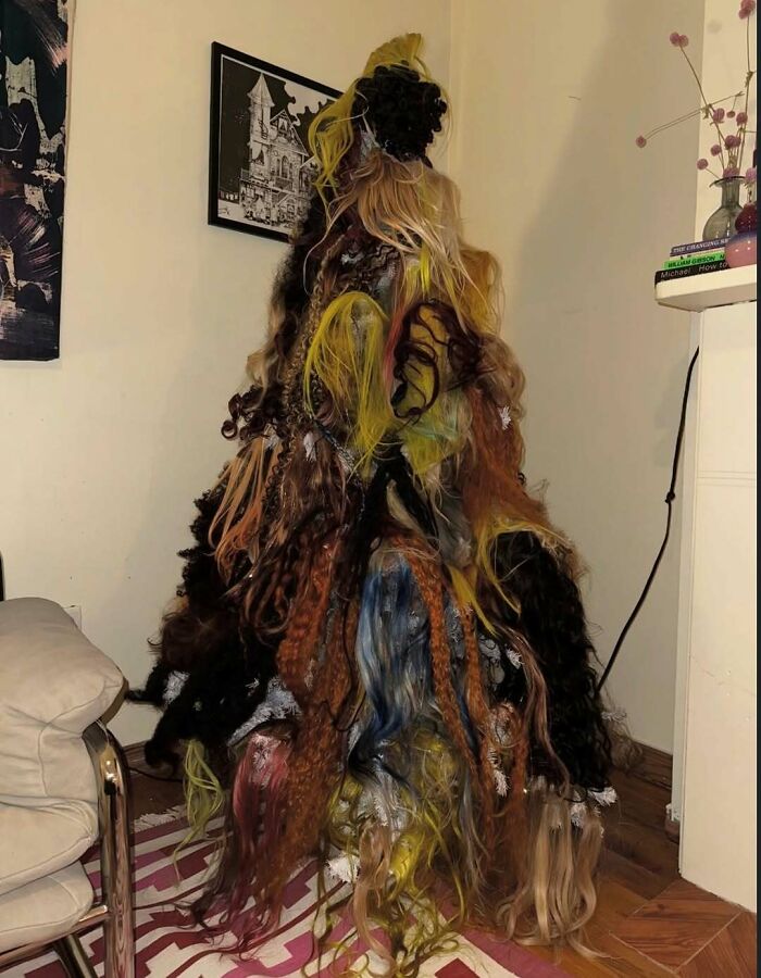 Unusual cursed photo showing a mysterious pile of multicolored hair extensions stacked in a corner of a room.