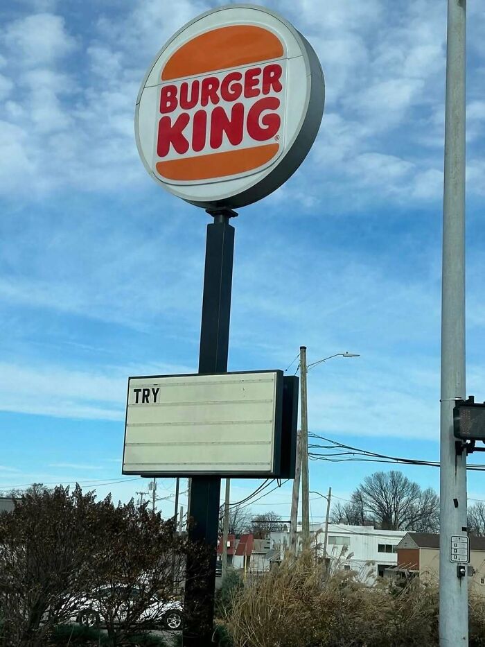 Burger King sign with an empty message board showing only the word try, a cursed photo that makes zero sense.