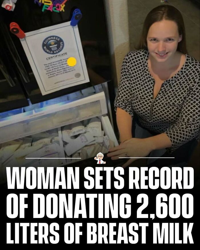 Woman smiling next to refrigerator with Guinness World Records certificate for donating 2,600 liters of breast milk.