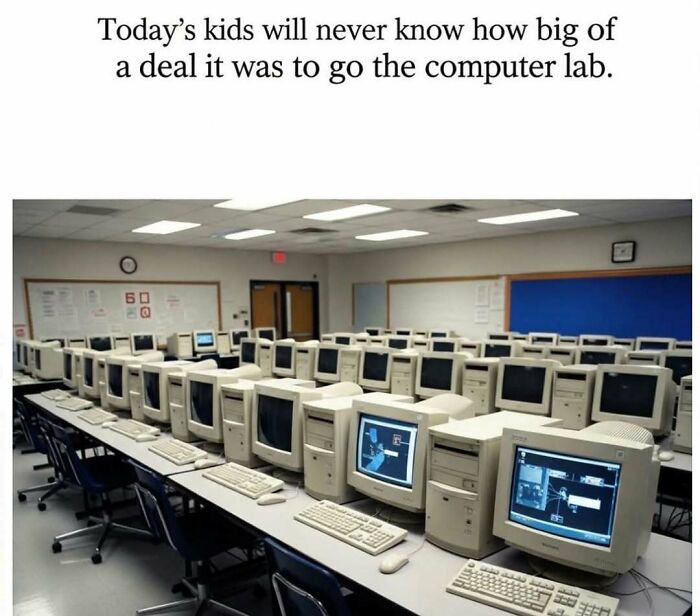 Rows of old desktop computers in a 90s computer lab, showcasing parts of our lives that don’t exist anymore.