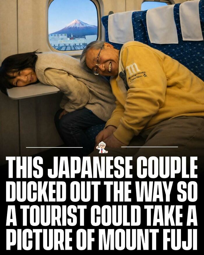 Japanese couple making space on train for tourist to take picture of Mount Fuji, a wholesome travel story.