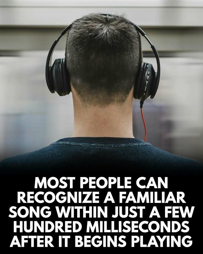 Person wearing black headphones facing away, displaying surprising fact about quick recognition of familiar songs.