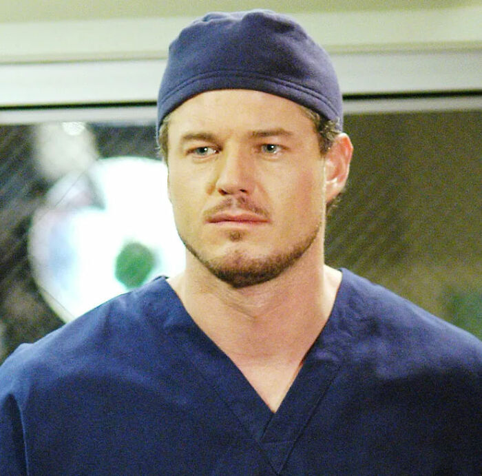 Eric Dane in medical scrubs, representing the Oscars in memoriam tribute controversy defended by Shonda Rhimes.