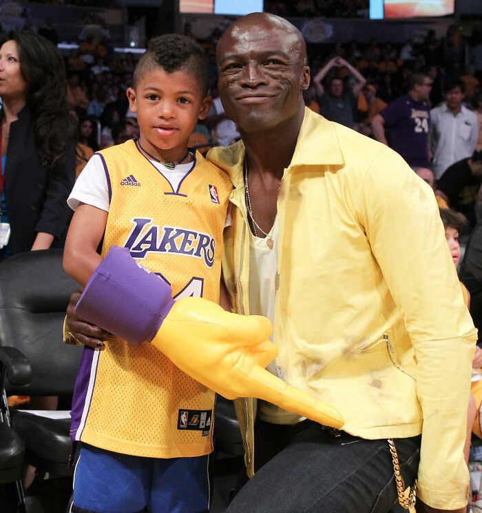 Heidi Klum and her son posing together at a premiere, attracting attention for her son's star-like look. Heidi Klum and her son posing together at a premiere, attracting attention for her son's star-like look.