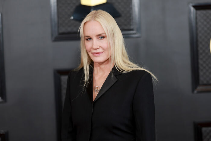 Daryl Hannah at an event, dressed in black, breaking decades-long silence on JFK Jr. in a scathing essay.