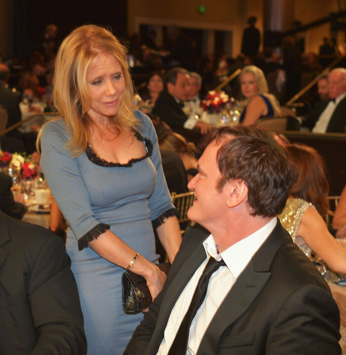 Quentin Tarantino and Rosanna Arquette interacting at a formal event, sparking fans to take sides over the response.