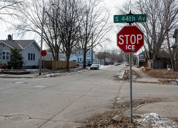 Residential street intersection with stop sign on S 44th Ave, symbolizing White House response to diversity statements.
