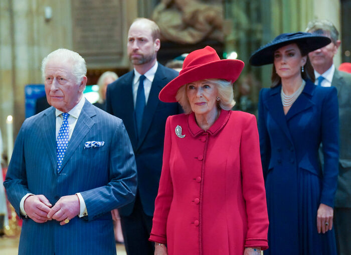 Prince William and royal family members attending largest royal gathering since Andrew's arrest with tense expressions.