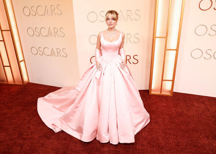 Mckenna Grace wearing a pink ball gown on the red carpet at the Oscars, capturing fans' admiration and attention. Mckenna Grace wearing a pink ball gown on the red carpet at the Oscars, capturing fans' admiration and attention.
