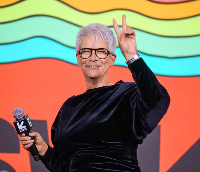 Jamie Lee Curtis speaking at SXSW event, making a peace sign, amid discussions on diversity and White House response.