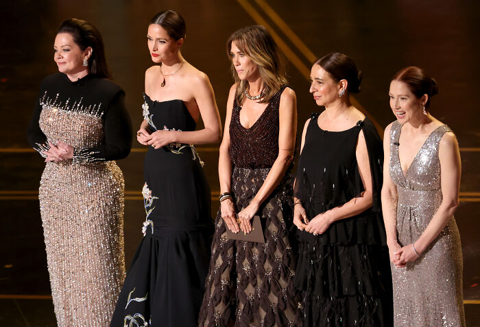 Bridesmaids cast reunites at the Oscars wearing elegant dresses during a highly anticipated event. Bridesmaids cast reunites at the Oscars wearing elegant dresses during a highly anticipated event.