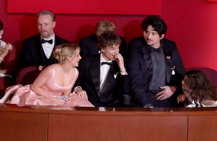 Mckenna Grace in a pink dress engaging with fellow attendees, captivating fans with her unexpected Oscars presence. Mckenna Grace in a pink dress engaging with fellow attendees, captivating fans with her unexpected Oscars presence.