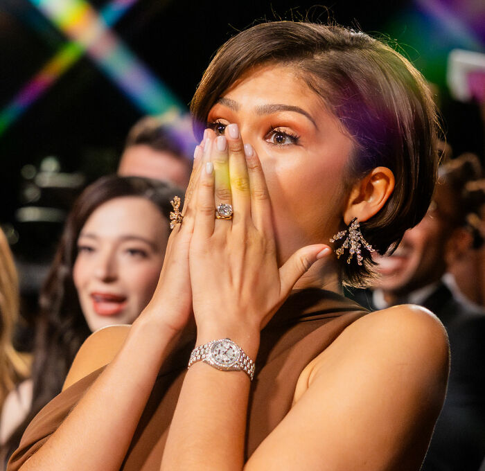 Zendaya reacting with surprise at an event, highlighting marriage rumors and real footage from the wedding.
