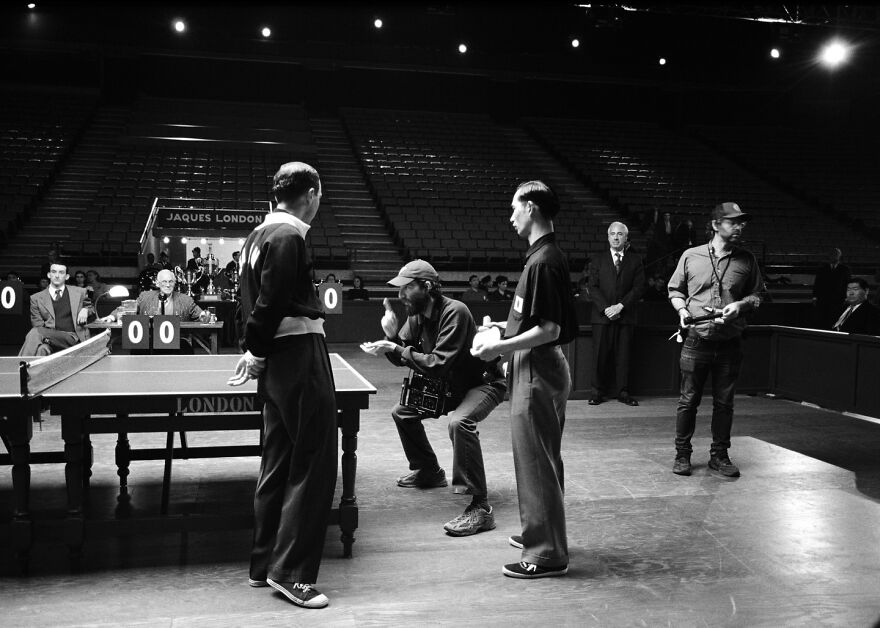 Black and white behind-the-scenes photo showing how Oscar-winning visuals enhance the movie experience on set.