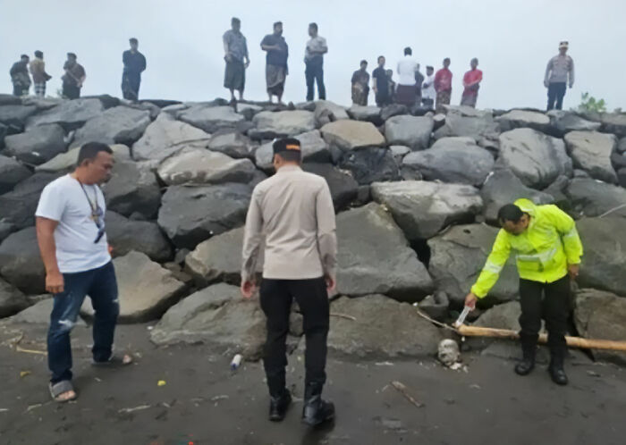 Police officers investigating a disturbing discovery on a rocky beach in Bali linked to son of wealthy businessman.