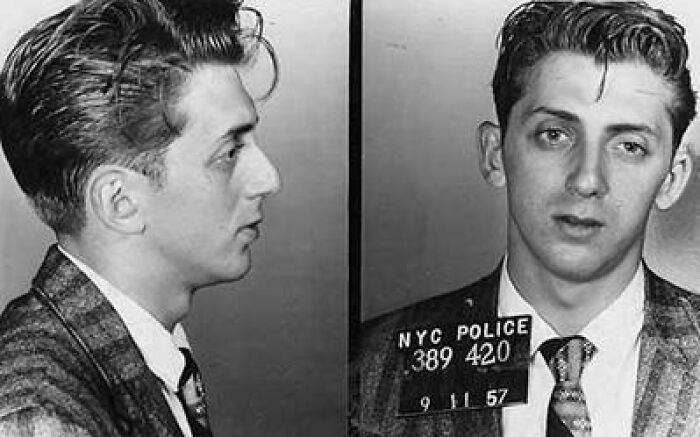 Black and white mugshot of a young man taken by NYC police, representing disturbing images of real life nightmares.