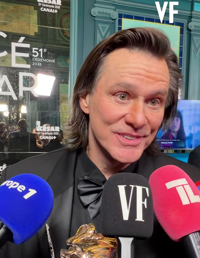 Jim Carrey speaking to reporters about his new face and the cause of his sadness at an award event.