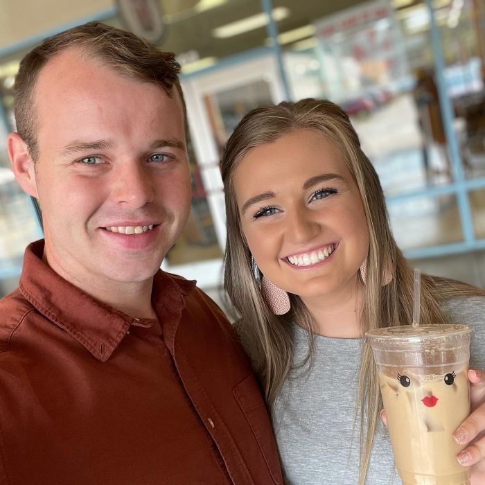 Joseph Duggar smiling with a woman holding a cup, related to past comments on brother Josh&rsquo;s misconduct after arrest.