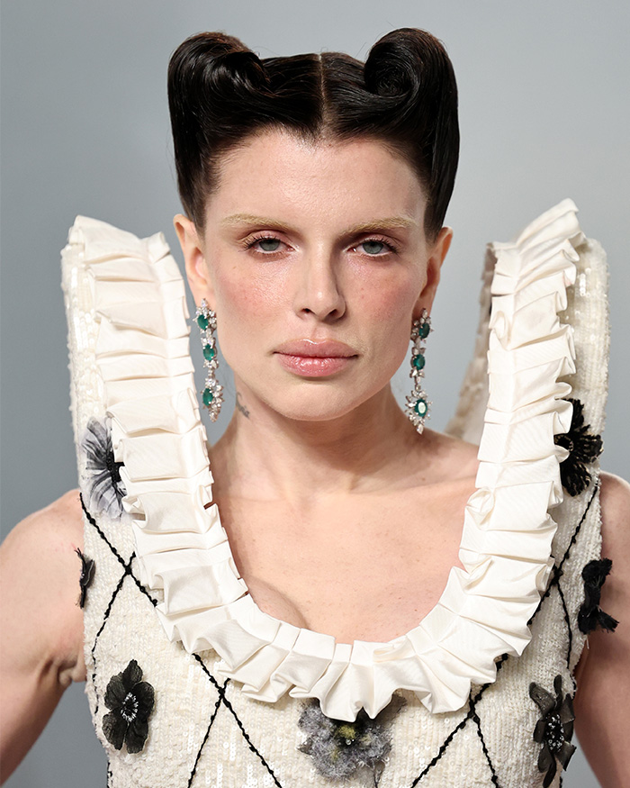 Close-up of a star showcasing natural skin texture under unforgiving lighting at the Oscars after-party unfiltered.