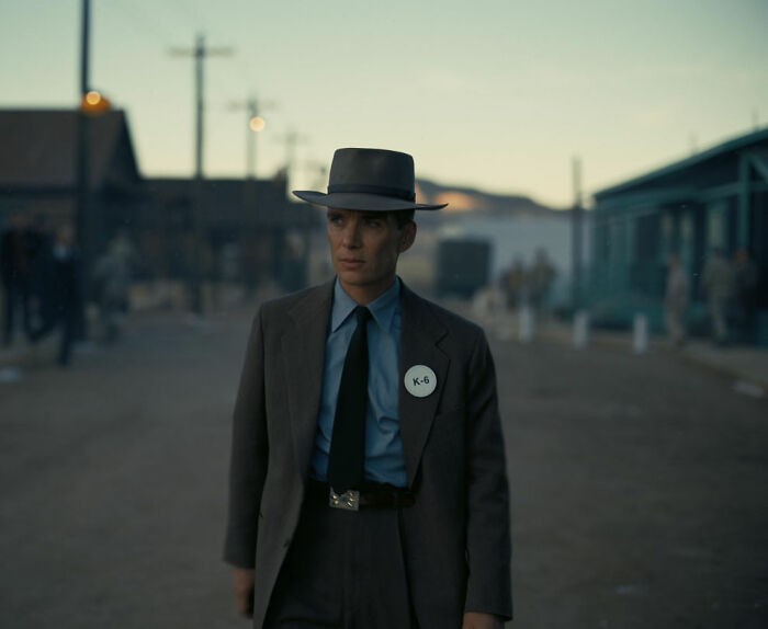 Actor in vintage suit and hat standing outdoors at dusk, related to new name to play Voldemort in Harry Potter series. Actor in vintage suit and hat standing outdoors at dusk, related to new name to play Voldemort in Harry Potter series.