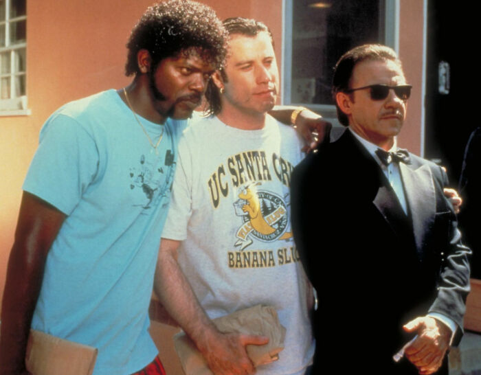 Actors Samuel L. Jackson, John Travolta, and Harvey Keitel in a scene from a Quentin Tarantino film, fans take sides.