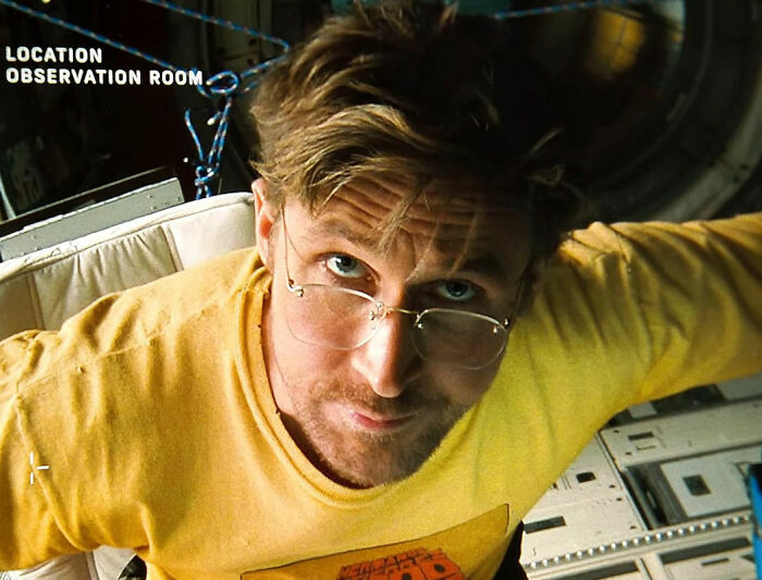 Ryan Gosling wearing glasses and a yellow shirt during a premiere appearance sparking fan speculation about his injector.