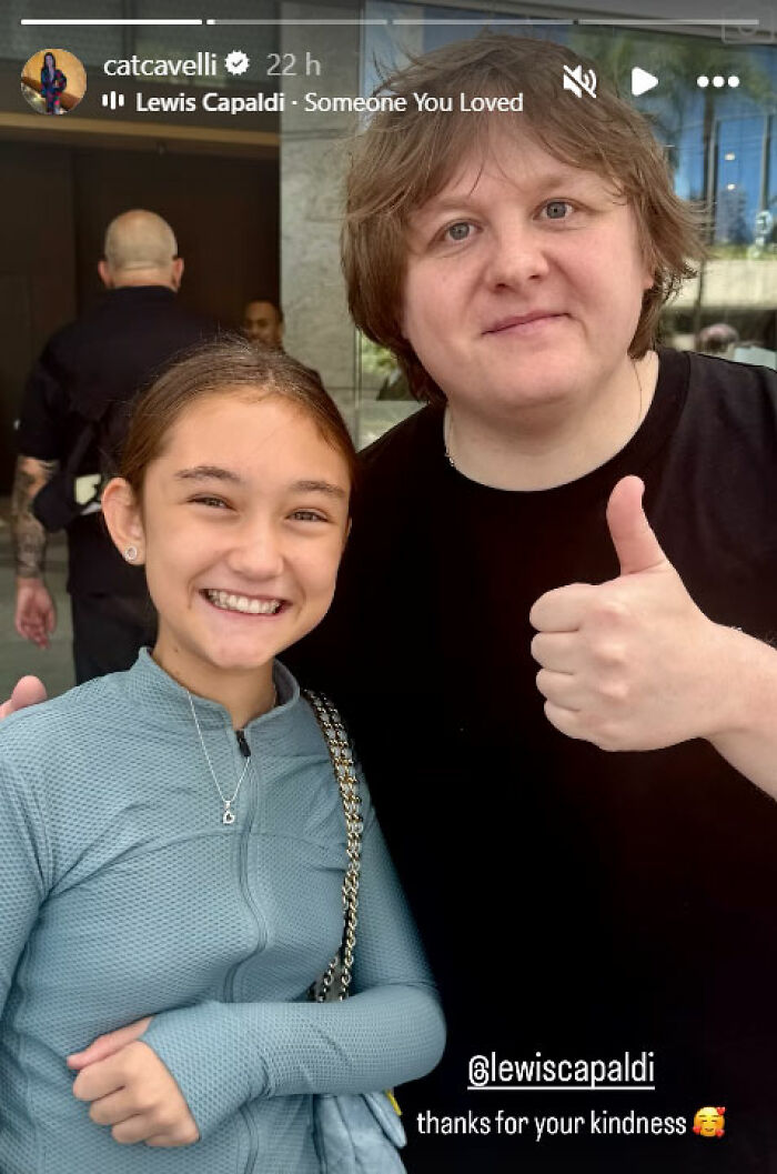 Two smiling people posing together outdoors, related to Jude Law's ex and Chappell Roan bodyguard incident.