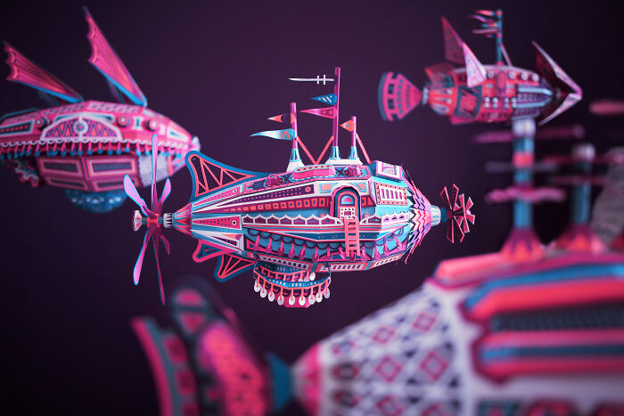 Detailed handcrafted paper submarine art with vibrant colors floating against a dark background by French artist duo.