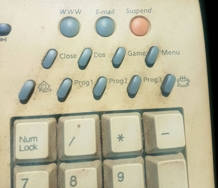 Close-up of a vintage keyboard with unique buttons labeled for internet functions and unidentified objects mystery solved.