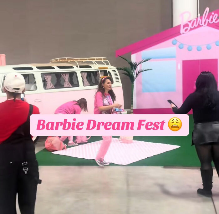 Attendees at Barbie Dream Fest event with pink-themed decor and vintage van, capturing guests’ reactions during the festival.