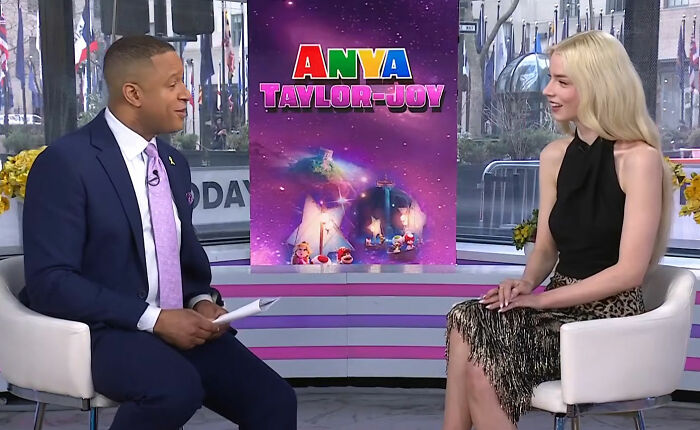 Craig Melvin and Anya Taylor-Joy seated during a Today interview, with a colorful promotional backdrop behind them.