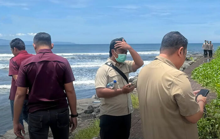 Police officers investigate a disturbing discovery linked to the son of a wealthy businessman in Bali near the ocean.