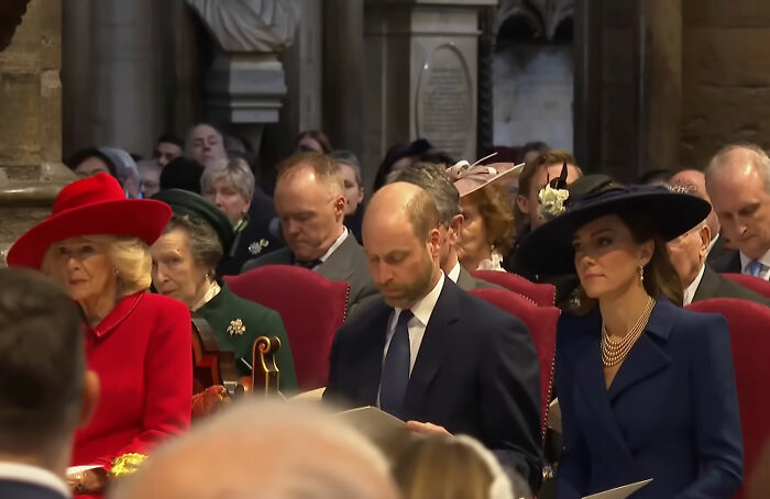 Prince William at largest royal gathering since Andrew&rsquo;s arrest, shown in formal attire with family members seated indoors.