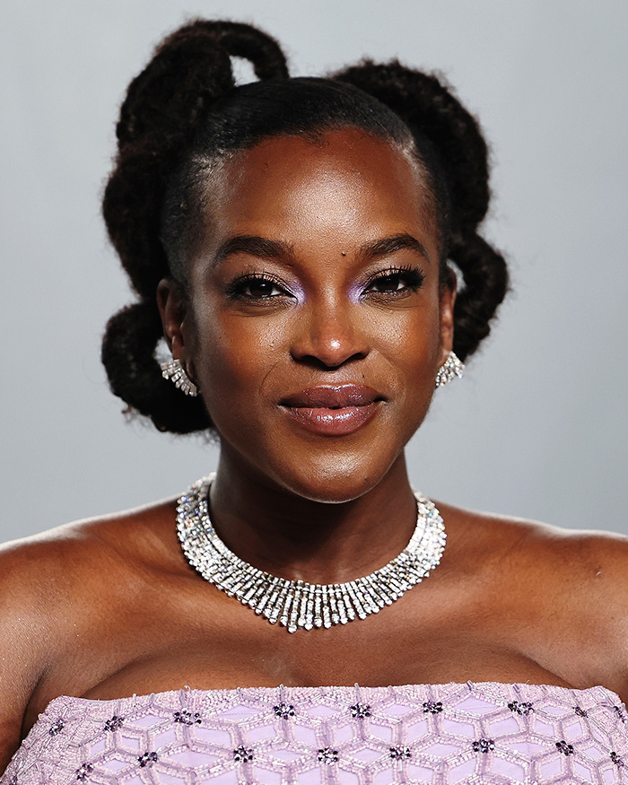 Close-up of a woman with glowing skin and natural makeup, highlighting stars' skins unfiltered look at the Oscars event.