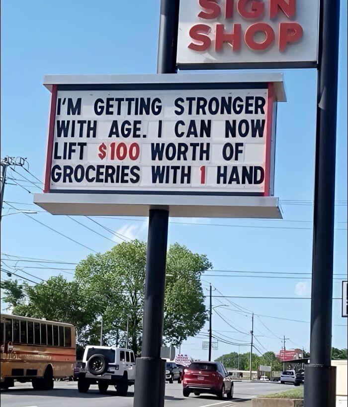 Funny roadside sign about getting stronger with age, making people laugh or do a double take while driving by.