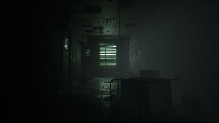 Dark abandoned room with broken furniture and a faint light, evoking terrifying moments for urban explorers.