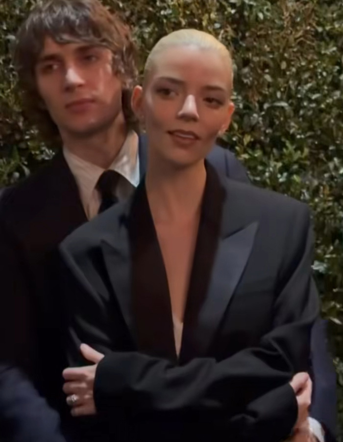 Anya Taylor‑Joy at pre‑Oscars dinner, wearing black blazer, with fans alarmed over spreading Hollywood trend.