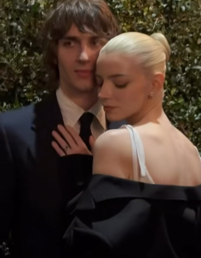 Anya Taylor-Joy posing at pre-Oscars dinner, wearing an off-shoulder outfit, raising concerns about Hollywood trend.