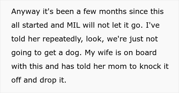 Text excerpt about breaking family tradition by deciding not to get a dog despite pressure from mother-in-law.