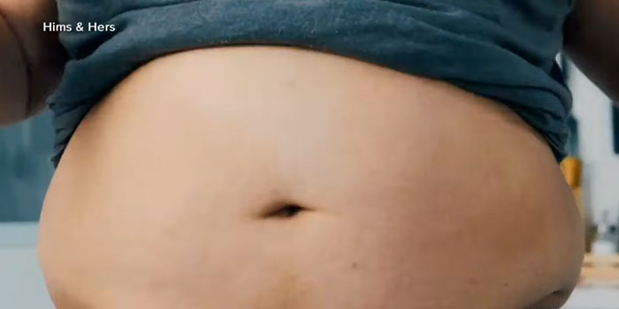 Close-up of a person’s stomach with a lifted shirt, illustrating one of the epic PR fails that people can’t believe.