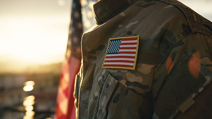 Close-up of a military uniform with a US flag patch, symbolizing an epic PR fail involving military imagery and branding.