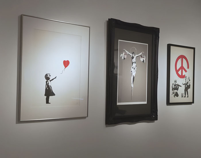 Fãs de Banksy convencidos de que sua arte cairá em valor depois que uma investigação bombástica desmascarou sua verdadeira identidade