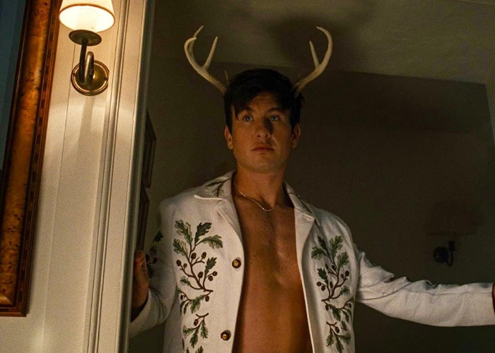 Barry Keoghan standing shirtless in decorative jacket with antlers behind him, reflecting on acting career and fan backlash. Barry Keoghan standing shirtless in decorative jacket with antlers behind him, reflecting on acting career and fan backlash.