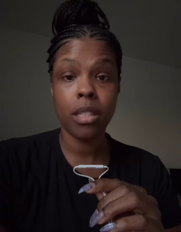 Woman speaking in a video about restaurant review bombed after waitress used Spanish racial slur unaware customer understood.